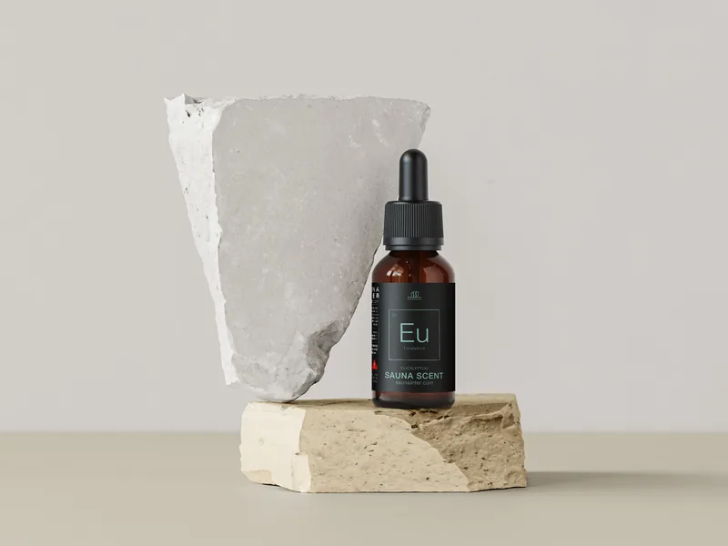 Sauflex Aroma+ eucalyptus sauna scent bottle on a stone plinth